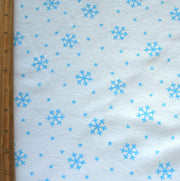 Blue Snowflakes on White Cotton Knit Fabric