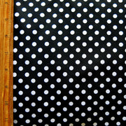 White Eraser Polka Dots on Black Nylon Spandex Swimsuit Fabric