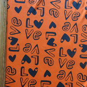 Love on Orange Cotton Spandex Jersey Knit Fabric