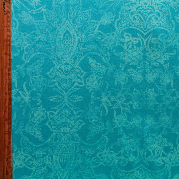 Antiqued Paisley on Mint Poly Spandex Knit Fabric