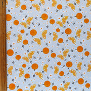 Daisies and Oranges on Blue Poly Spandex Swimsuit Fabric