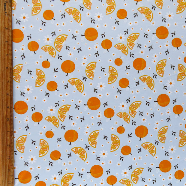 Daisies and Oranges on Blue Poly Spandex Swimsuit Fabric