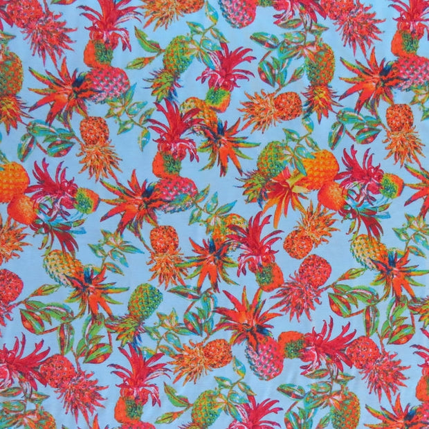 Colorful Pineapples on Light Blue Nylon Spandex Swimsuit Fabric