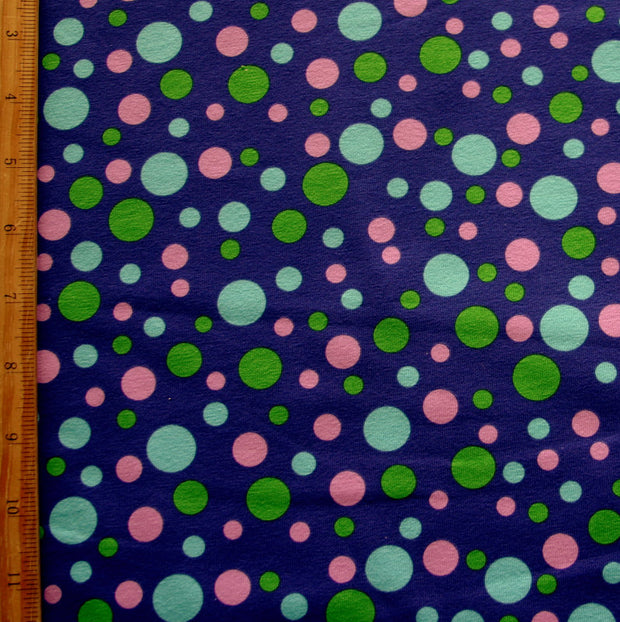 Green, Aqua, and Lavender Bubble Dots on Purple Cotton Lycra Knit Fabric