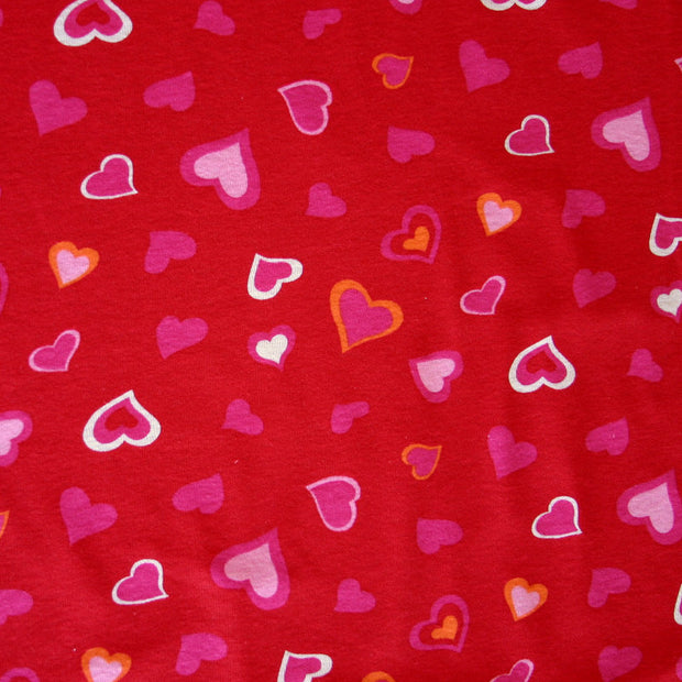 Pink, White, and Orange Hearts on Red Cotton Knit Fabric - 26" Remnant Piece