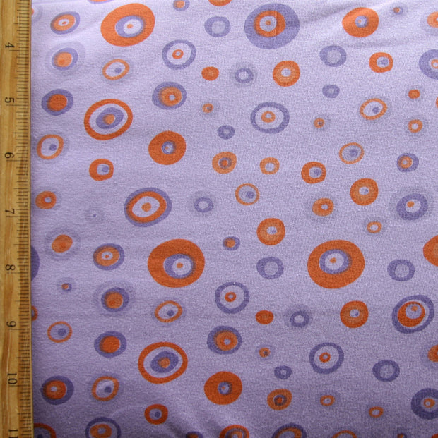 Orange and Purple Circles and Dots on Purple Cotton Lycra Knit Fabric