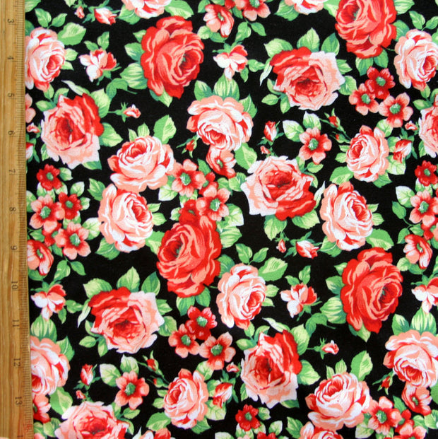 Peachy Keen Roses on Black Cotton Lycra Knit Fabric - 34" Remnant
