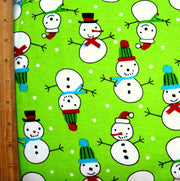 Snowmen and Polka Dots on Lime Cotton Knit Fabric