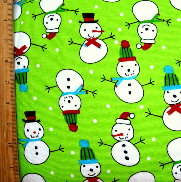 Snowmen and Polka Dots on Lime Cotton Knit Fabric