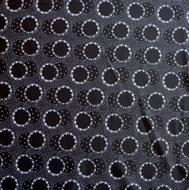 White Daisey Circles on Black Nylon Spandex Swimsuit Fabric