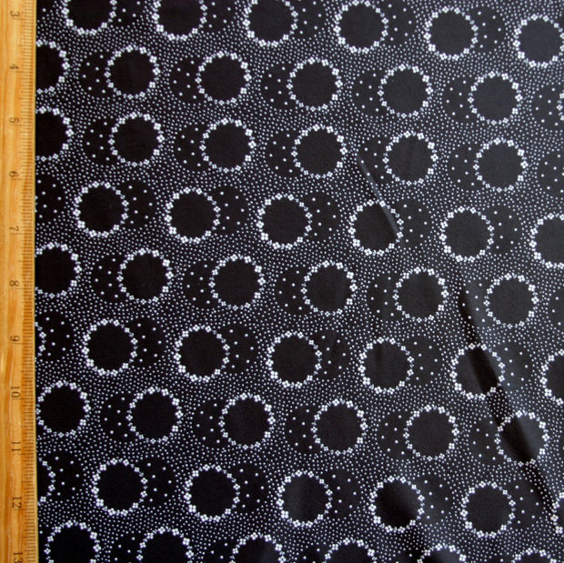 White Daisey Circles on Black Nylon Spandex Swimsuit Fabric