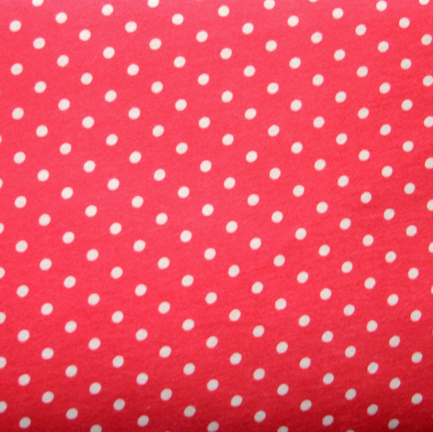 White Eraser Polka Dots on Coral Pink Cotton Knit Fabric