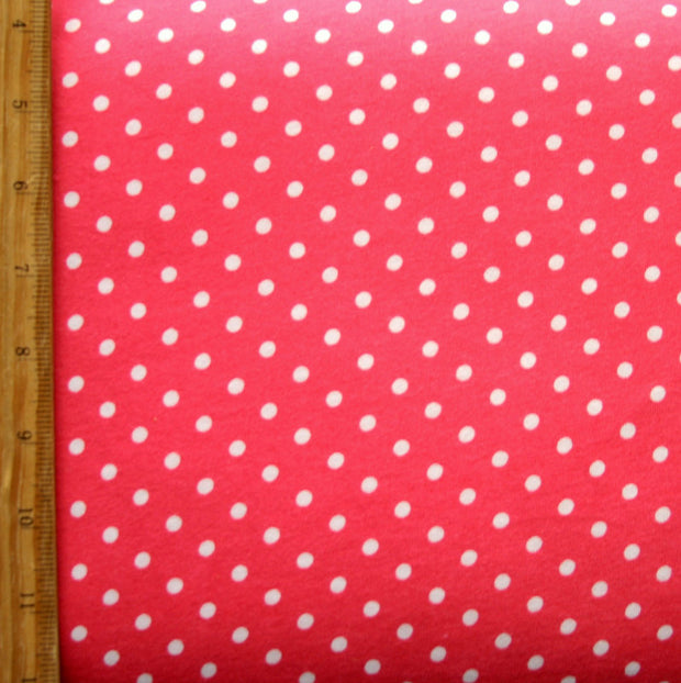 White Eraser Polka Dots on Coral Pink Cotton Knit Fabric