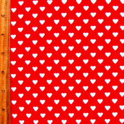 Dainty White Hearts on Red Cotton Lycra Knit Fabric